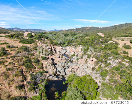 Aerial view of Los Penasquitos Canyon Preserve with the creek waterfall, San Diego 67723045