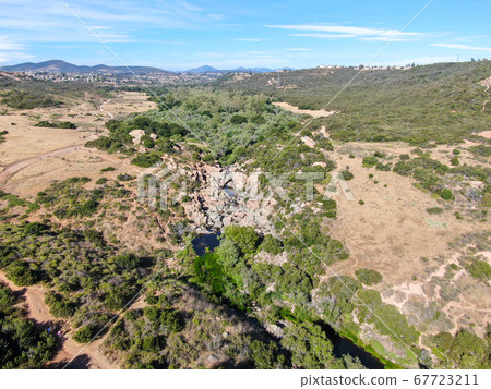 Aerial view of Los Penasquitos Canyon Preserve with the creek waterfall, San Diego 67723211