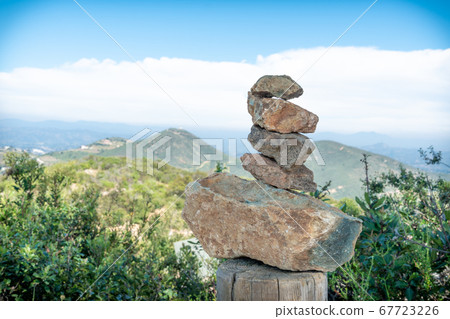 Zen pile of rocks made on the top of the mountain. California 67723226