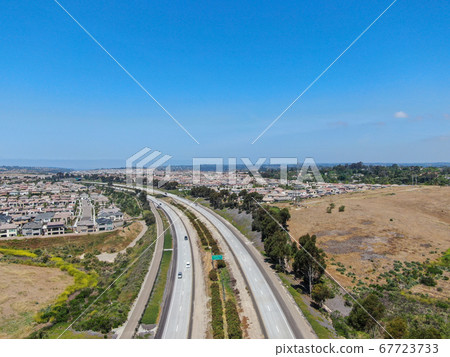 Aerial view of highway, freeway road with vehicle in movement Aerial view of highway, freeway road with vehicle in movement 67723733