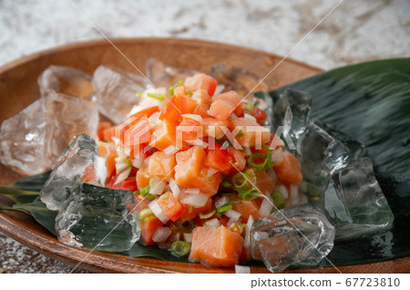 lomi-lomi salmon with ice in wooden plate lomi-lomi salmon with ice in wooden plate 67723810
