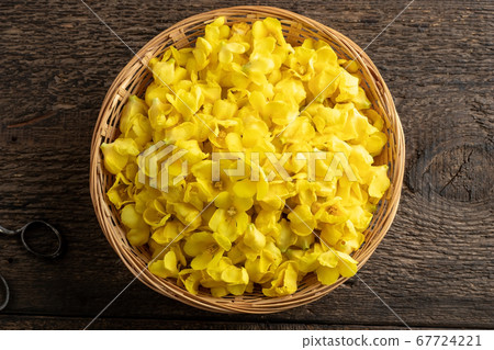 Fresh mullein flowers in a wicker basket, top view 67724221
