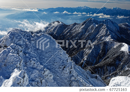 View of Mt. Gongen and the Southern Alps from the summit of Mt. Yatsugatake and Mt. Akadake View of Mt. Gongen and the Southern Alps from the summit of Mt. Yatsugatake and Mt. Akadake 67725163