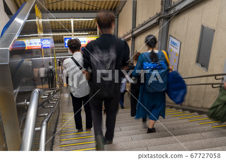 Passengers returning home at night station 67727058