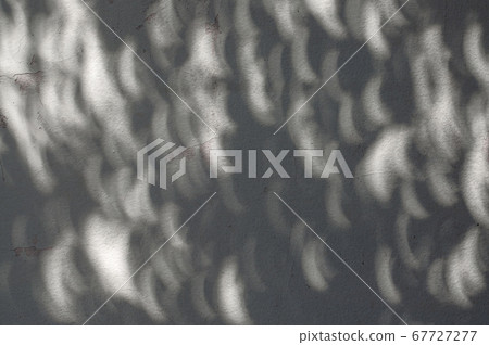 Shadow of solar eclipse on concrete wall Shadow of solar eclipse on concrete wall 67727277