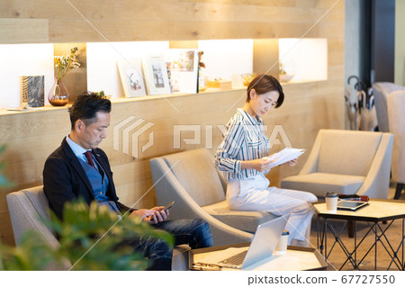 A businessman working in a cafe A businessman working in a cafe 67727550