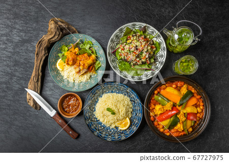 Moroccan clay pot with Tajine pot and North African food Moroccan clay pot with Tajine pot and North African food 67727975