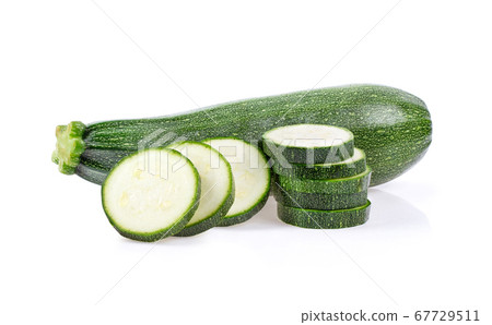 green zucchini with slice on white background 67729511