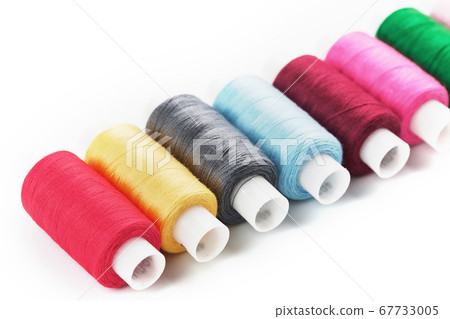 Sewing threads of different colors on reels on a 67733005