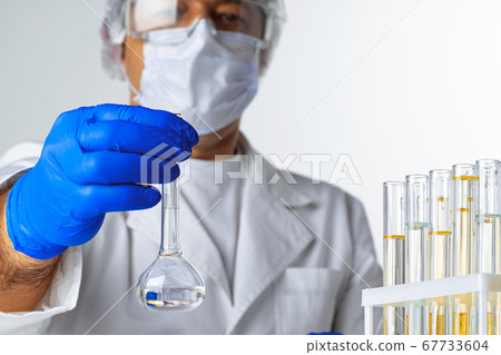 Close up of hands of a scientist working with laboratory samples 67733604