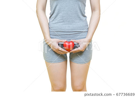 woman in gray clothes holding red heart put on the chest area,Health-care concept on white background, healthy girl medical awareness cancer prevention concept woman in gray clothes holding red heart put on the chest area,Health-care concept on white background, healthy girl medical awareness cancer prevention concept 67736689