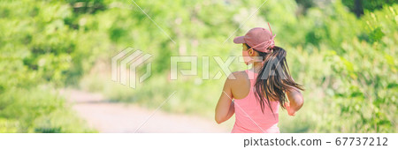 COVID-19 sport mask runner running outdoor wearing protective face cover jogging outside for coronavirus prevention in public. Outdoor summer lifestyle panoramic banner 67737212