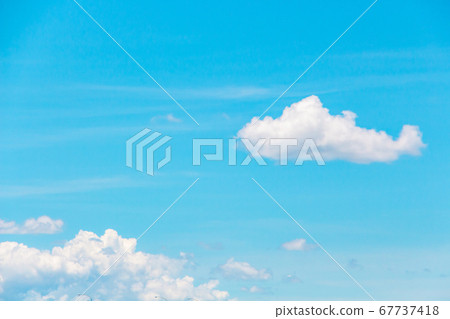 Clouds floating in the clear summer sky 67737418