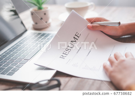 People are reviewing job applications before 67738682