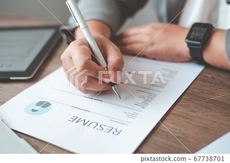 People are filling out their resume on the job People are filling out their resume on the job 67738701