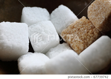 Sugar cubes in a container Sugar cubes in a container 67739742