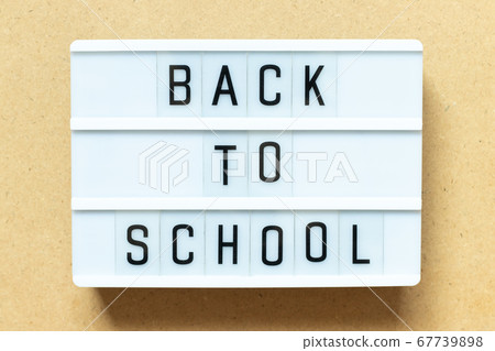 Lightbox with word back to school on wood background Lightbox with word back to school on wood background 67739898