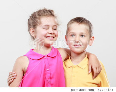 Happy joyful cute kids little girl and boy. 67742123