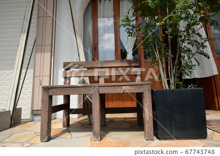 Chairs and flowerpots 67743748