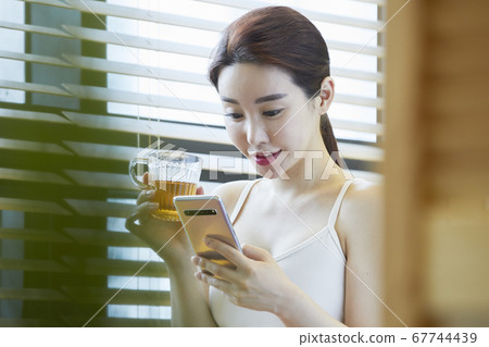 Smartphone, Tea Time, Tea Therapy, Foot Bath, Healing, Young Woman Smartphone, Tea Time, Tea Therapy, Foot Bath, Healing, Young Woman 67744439