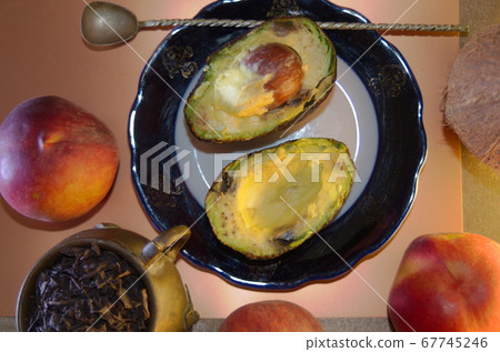 food composition - two avocado halves on a plate food composition - two avocado halves on a plate 67745246