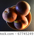 peaches close-up in a file on a dark background 67745249