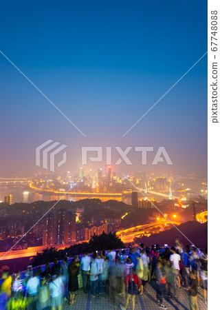 Chongqing, China downtown city skyline over the Chongqing, China downtown city skyline over the 67748088