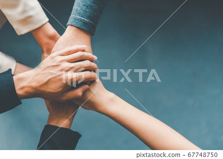Top view hands of business people come together in 67748750