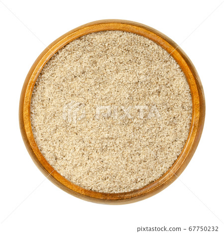 Bourbon vanilla sugar in wooden bowl. Crystal sugar with ground Bourbon vanilla pods, used for baking and to flavor food. Close-up, from above, on white background, isolated, macro food photo. 67750232