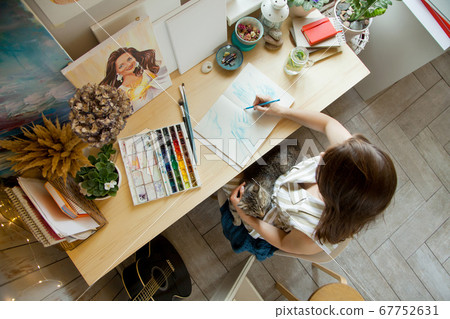 Artist Creative Designer Illustrator Graphic Skill Concept. On the table are brushes, paints, sketchbooks, and blank canvases. Workplace. Artist Creative Designer Illustrator Graphic Skill Concept. On the table are brushes, paints, sketchbooks, and blank canvases. Workplace. 67752631