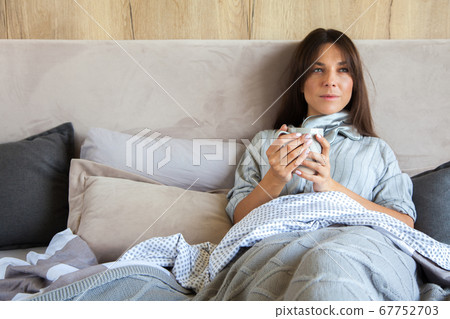 Good morning! Woman woke up in bed. Woman drinking coffee in bed Good morning! Woman woke up in bed. Woman drinking coffee in bed 67752703