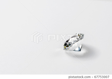 Dazzling diamond on neutral light background. Dazzling diamond on neutral light background. 67753007