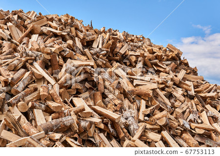 huge pile of firewood against the sky 67753113