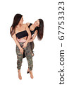 Two lovely woman standing, looking at each other 67753323
