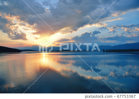 Beautiful Nature Background.Amazing Colorful Clouds.Water Reflections.Magic Artistic Wallpaper.Creative Photography.Blue Sky and Sunset.Mountain Landscape.Tranquil Panorama.Sun and Lake.Blue Color. Beautiful Nature Background.Amazing Colorful Clouds.Water Reflections.Magic Artistic Wallpaper.Creative Photography.Blue Sky and Sunset.Mountain Landscape.Tranquil Panorama.Sun and Lake.Blue Color. 67753367