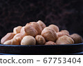 close-up handful hazelnuts 67753404