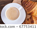 Close-up cap coffee cappuccino and croissant 67753411