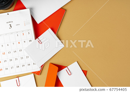 Red and white blank branding paper on beige background Red and white blank branding paper on beige background 67754405