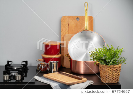 Kitchen counter with copper pots and gas stove Kitchen counter with copper pots and gas stove 67754667