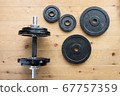 Dumbbells on the floor at home Dumbbells on the floor at home 67757359