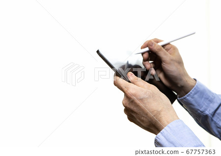 Man using tablet and stylus pen 67757363