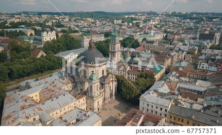 Aerial drone shot of city Lviv, Ukraine. Ancient Ukraine Dominican Church. Panorama of old town 67757371