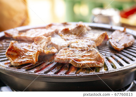 Beef tongue being baked on an iron plate 67760813