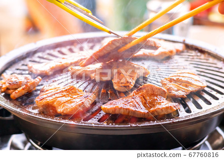 Beef tongue being baked on an iron plate 67760816