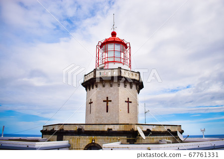 Bright colourful photo of a famous light house on Azorean island 67761331