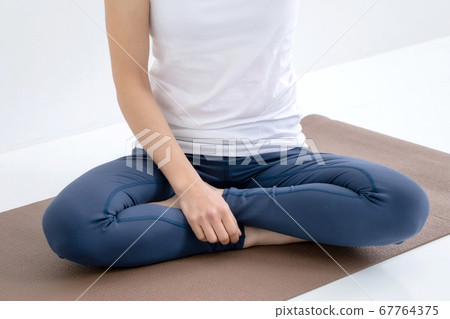A woman wearing sportswear A woman wearing sportswear 67764375
