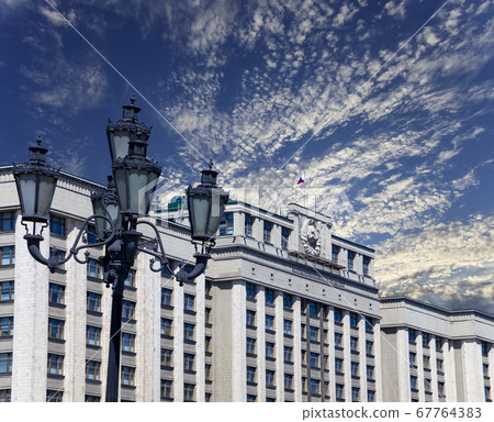 Building of The State Duma of the Federal Assembly of Russian Federation on a beautiful sky with cloud before sunset background, Moscow, Russia Building of The State Duma of the Federal Assembly of Russian Federation on a beautiful sky with cloud before sunset background, Moscow, Russia 67764383