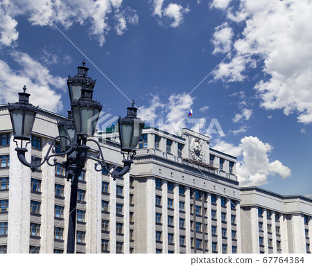 Building of The State Duma of the Federal Assembly of Russian Federation on a beautiful sky with cloud before sunset background, Moscow, Russia Building of The State Duma of the Federal Assembly of Russian Federation on a beautiful sky with cloud before sunset background, Moscow, Russia 67764384