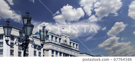 Building of The State Duma of the Federal Assembly of Russian Federation on a beautiful sky with cloud before sunset background, Moscow, Russia Building of The State Duma of the Federal Assembly of Russian Federation on a beautiful sky with cloud before sunset background, Moscow, Russia 67764386