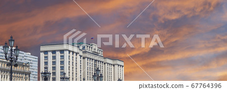 Building of The State Duma of the Federal Assembly of Russian Federation on a beautiful sky with cloud before sunset background, Moscow, Russia Building of The State Duma of the Federal Assembly of Russian Federation on a beautiful sky with cloud before sunset background, Moscow, Russia 67764396